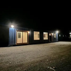 finished shipping container home exterior at night