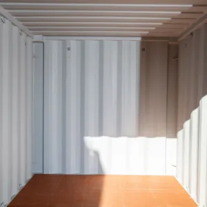 Blue 8ft one-trip shipping container with doors open