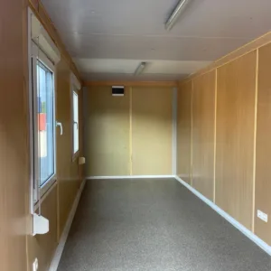 20ft office container interior with finished wall panels and lighting